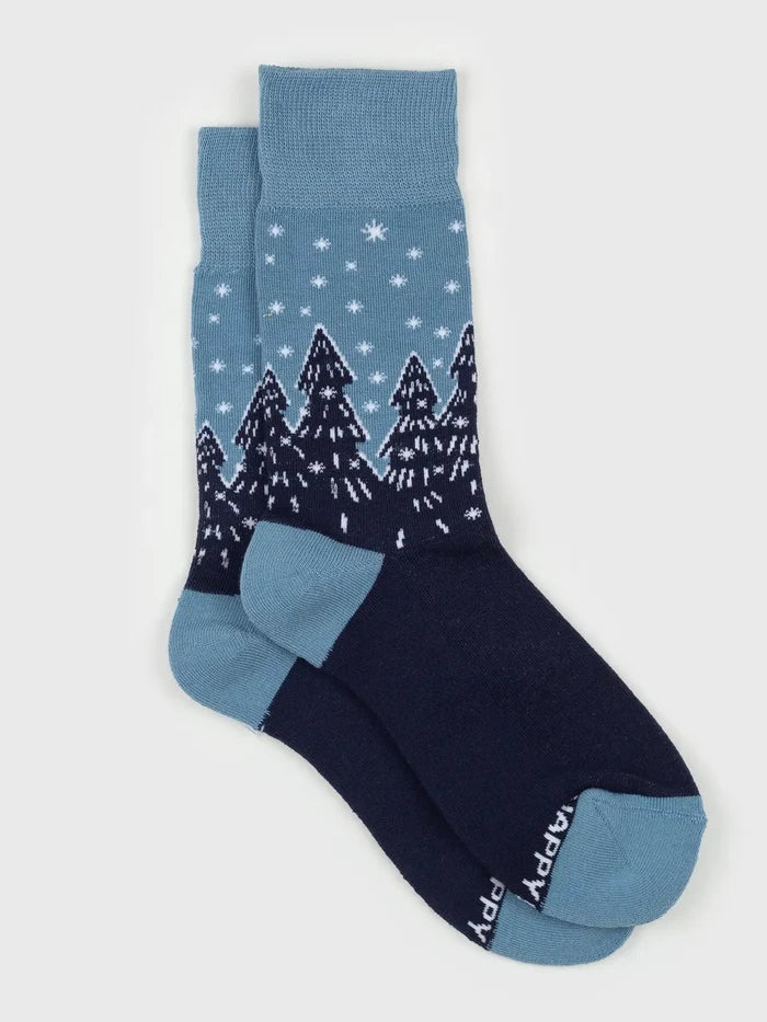 Forest Flurries Socks in blue gradient with white snowflakes and dark pine trees