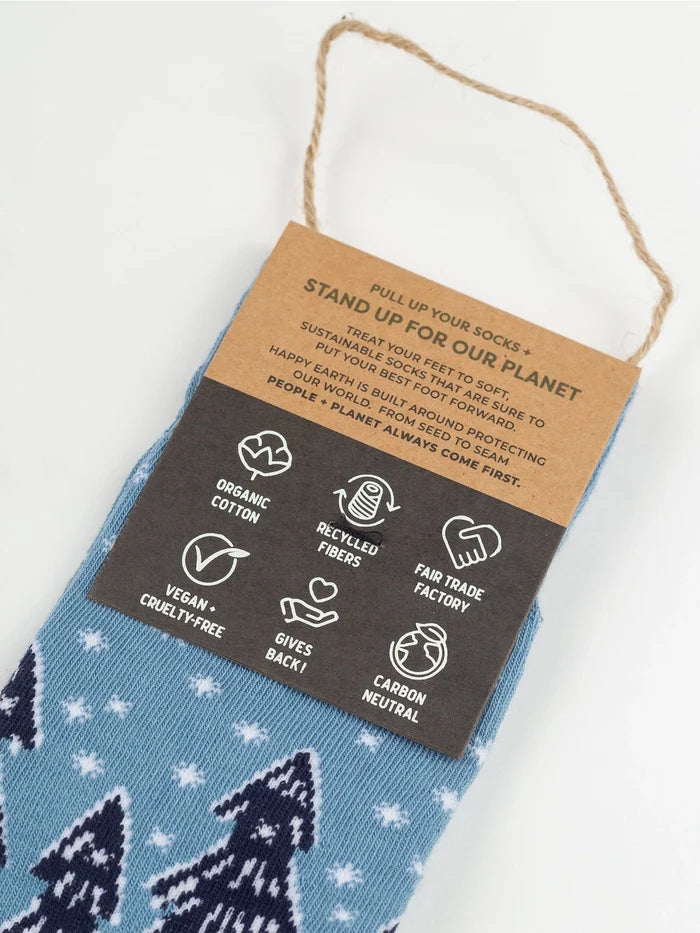 Forest Flurries Socks with a sustainability tag showing organic cotton recycled fibers and fair trade icons