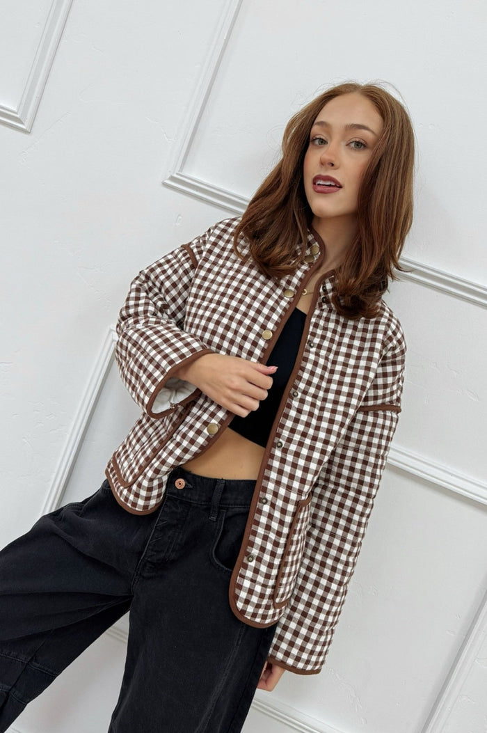 girl in brown gingham jacket with snap buttons and front functional 
pockets