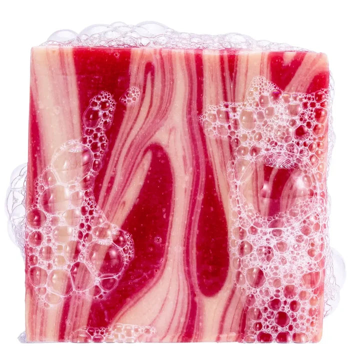 Marbled pink and red Frosty Peppermint soap bar with bubbles on top