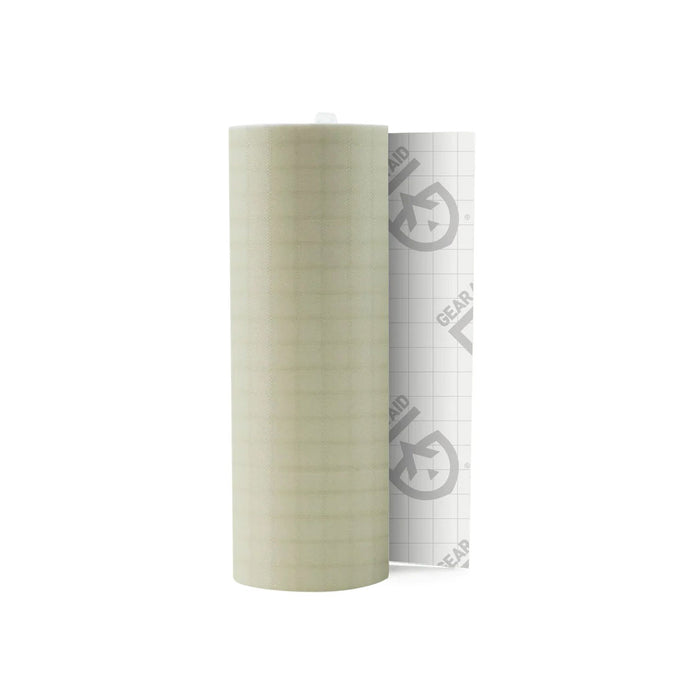 Roll of Gear Aid Tenacious repair tape in ripstop sage green showing part of the backing tape photographed on a white background