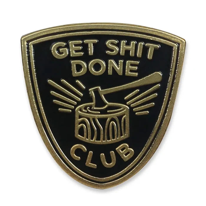 Shield shaped gold and black enamel pin with GET SH*T DONE CLUB and an axe graphic.