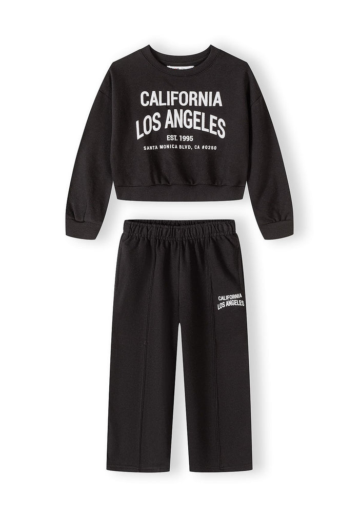 Black girls' jogging suit with cropped sweatshirt and loose trousers, front view.