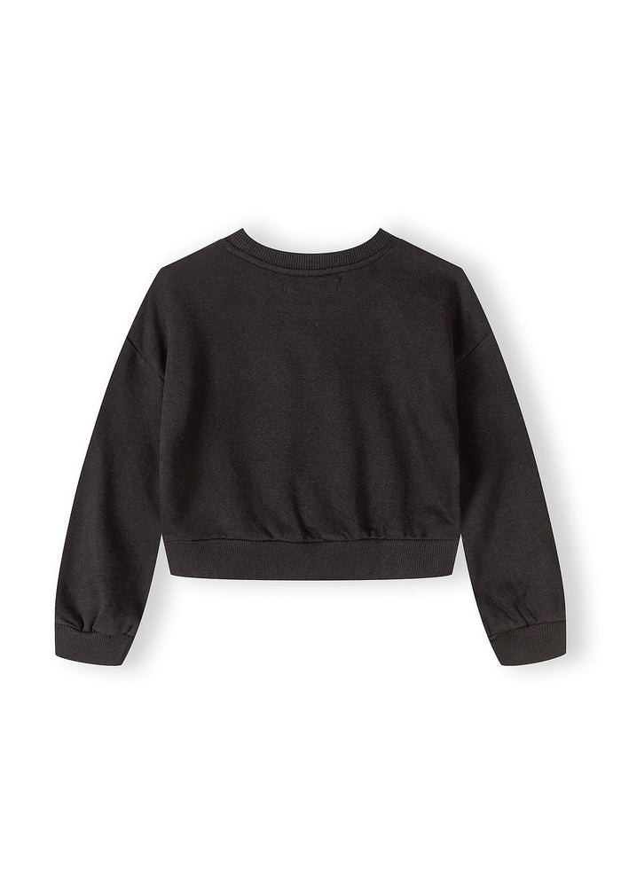 Back view of a black girls' jogging suit jacket with a crew neckline and long sleeves.