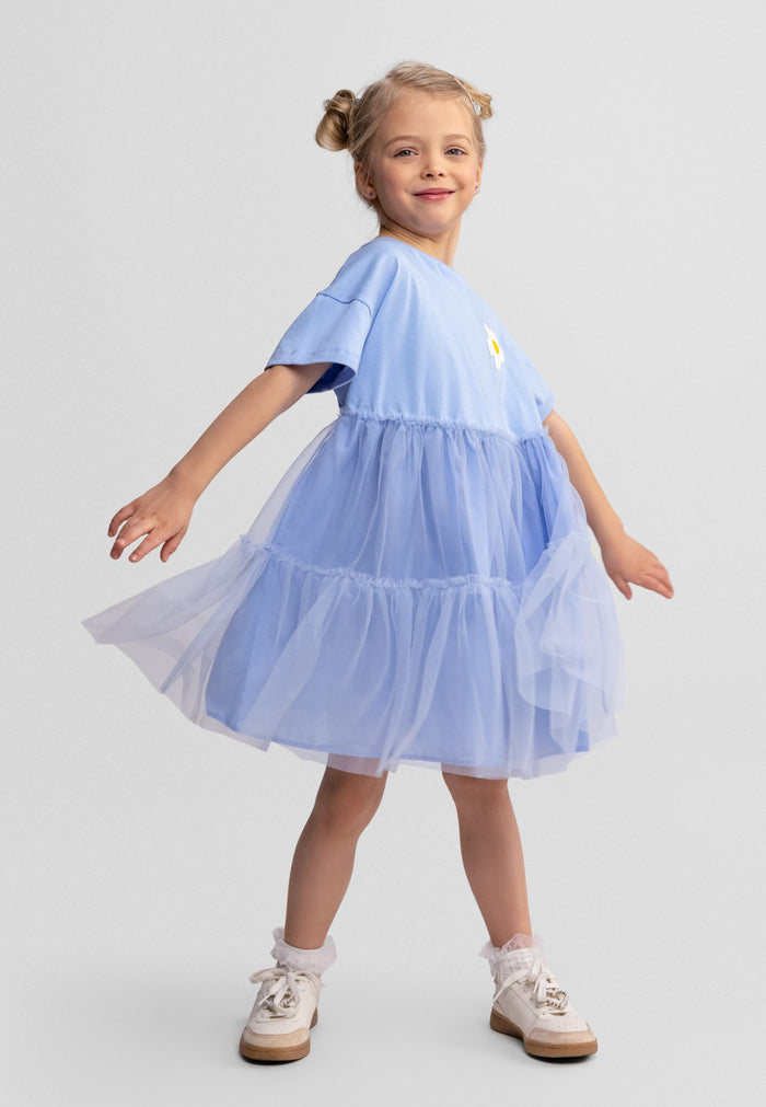 Girls blue jersey dress with layered tulle and crochet flower, front view.