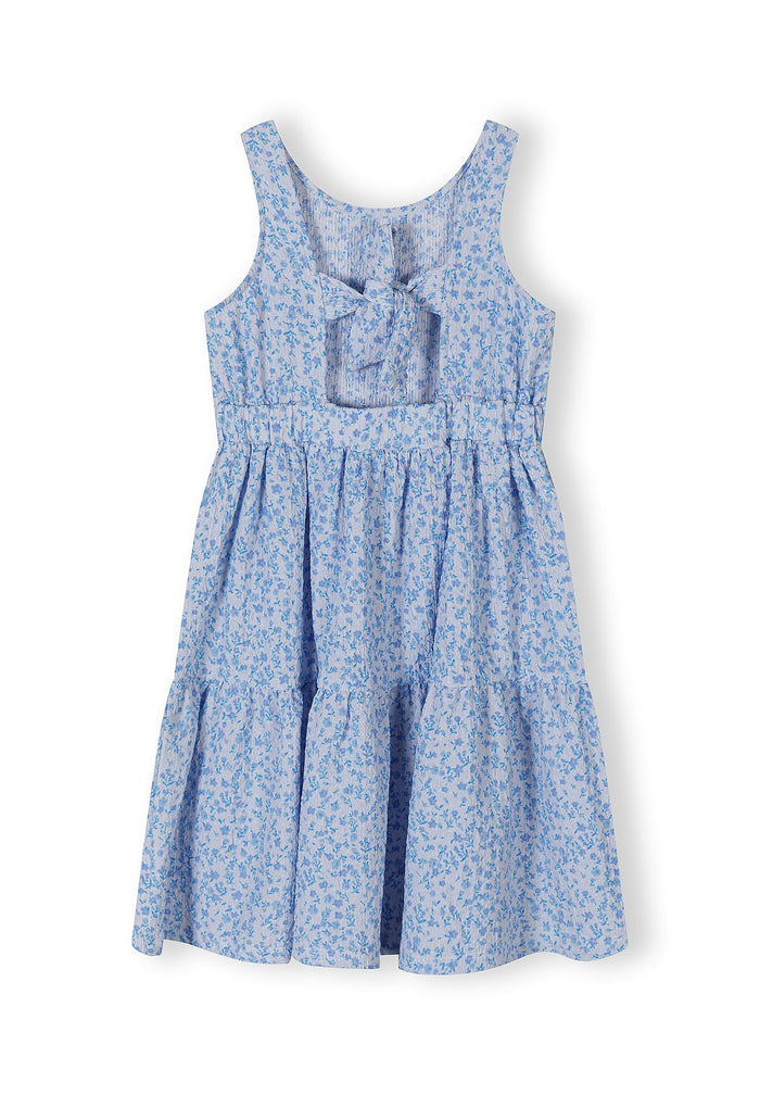 Girls sleeveless blue floral summer dress, tiered design, round neckline.
