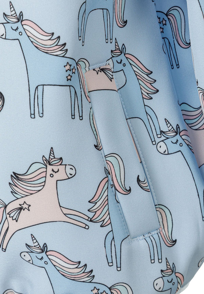 Detail of a light blue softshell jacket featuring unicorn prints and a front pocket.