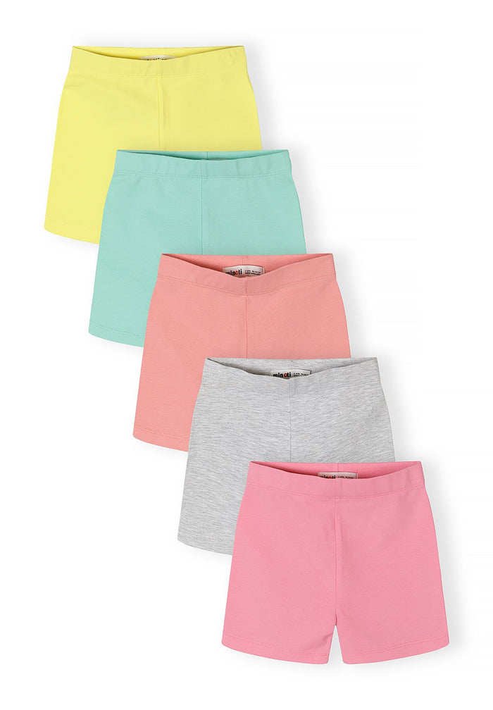 Detail of girls' cotton stretch bike shorts in pastel colors, featuring an elasticated waistband.
