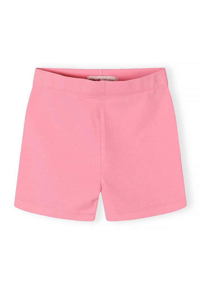 Girls pink cotton stretch bike shorts, front view, slim fit with elasticated waistband.