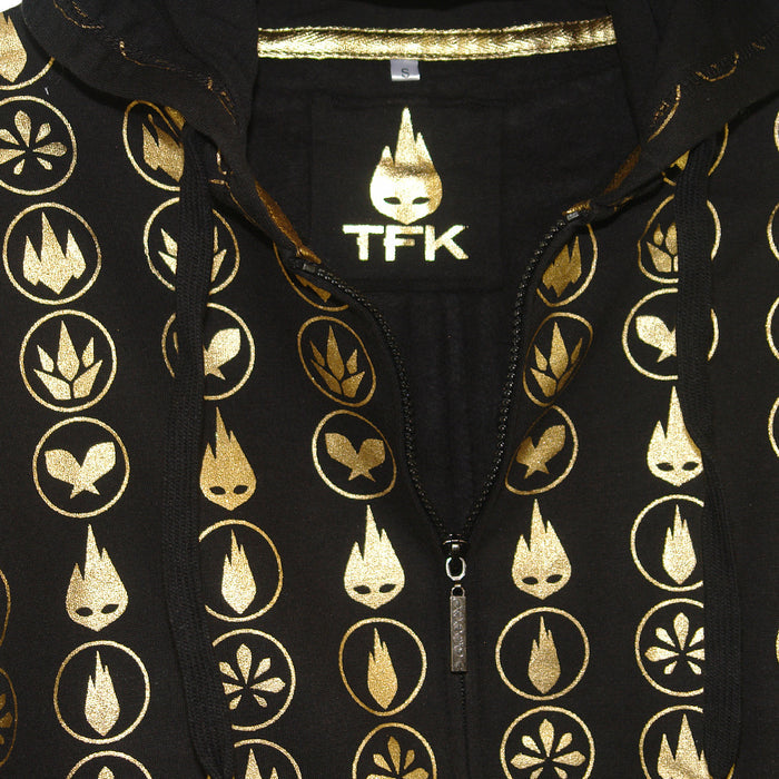 A black Thousand Foot Krutch hoodie with gold zipper and hood strings, gold TFK logos, circular flame designs, and TFK text beneath a stylized flame emblem on the chest.