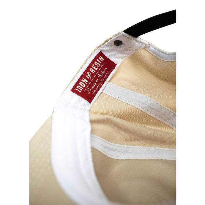 Interior close-up of Good Luck Hat showing a red Iron & Resin label stitched on the white sweatband.