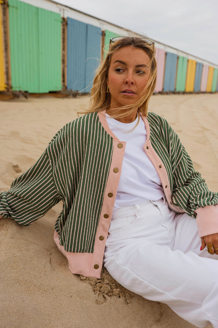 Model wearing green and pink Verda cardigan