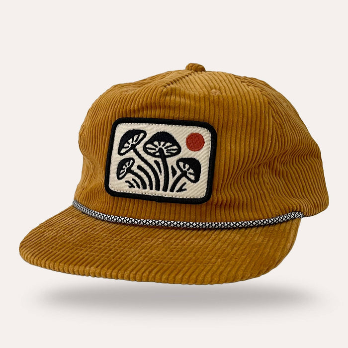 Mustard corduroy flat brim hat featuring a groovy mushroom patch
