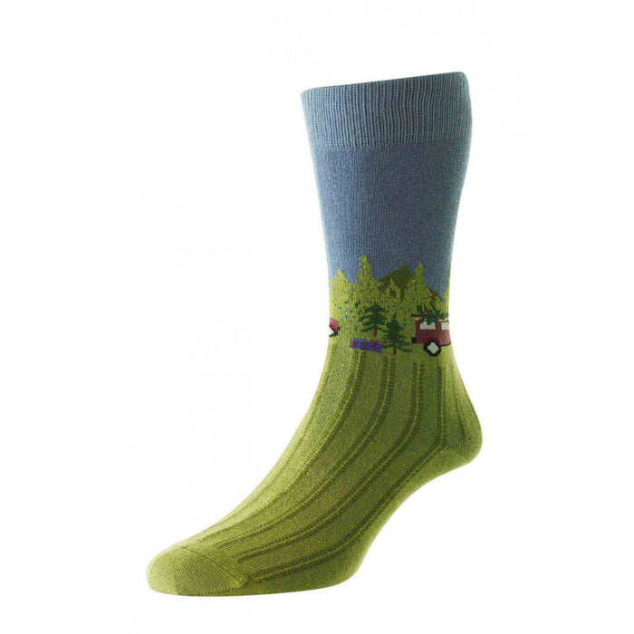 Studio shot on a white background of a HJ Hall Cotton Rich Men's sock in a foot dummy showing the light green forest scene design