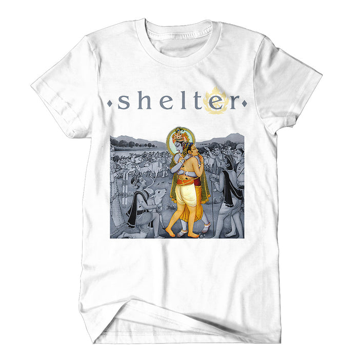 Shelter brand white t-shirt with shelter text above a stylized Hindu deity walking with a companion, surrounded by a grayscale crowd illustration.