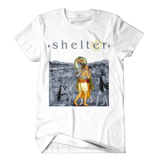 Shelter brand white t-shirt with shelter text above a stylized Hindu deity walking with a companion, surrounded by a grayscale crowd illustration.