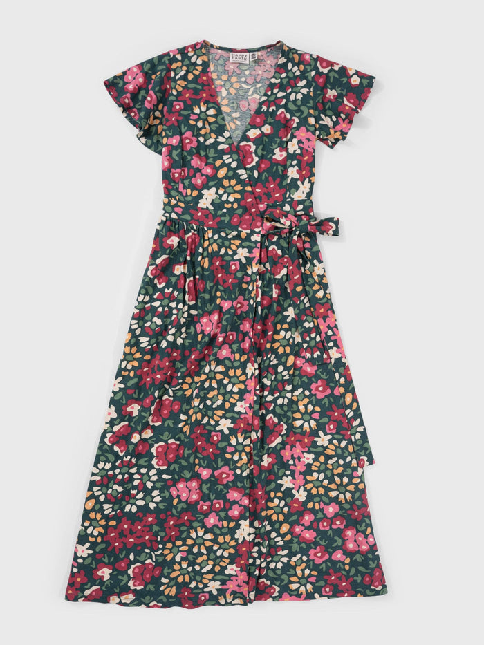 Isla Dress close up with wrap front and waist tie in a vivid floral print.