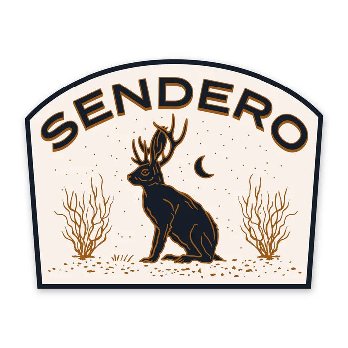 Jackalope sticker with a seated deer figure and antlers under a crescent moon and desert plants