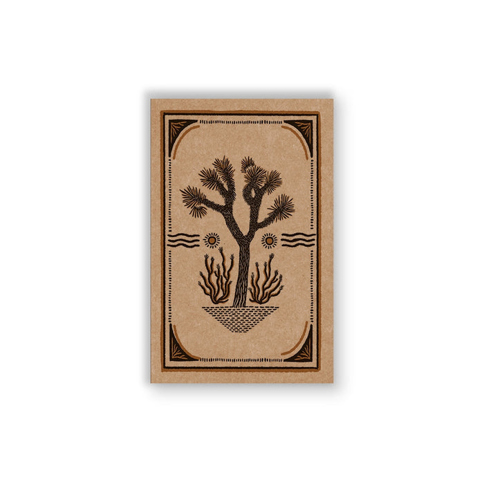 Joshua Tree Kraft Classic Layflat Notebook with a brown kraft cover and black desert tree illustration.