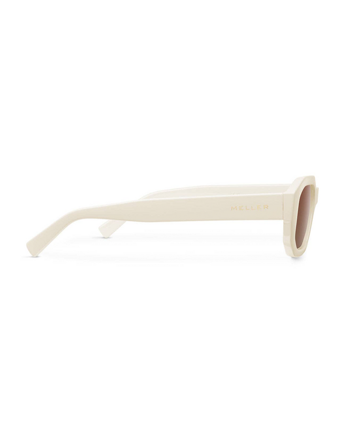 The Kessie Sunglasses by Meller feature thick beige rectangular frames with a subtle geometric shape, shown from the side. Gold "MELLER" branding adorns the arm, and the lightly tinted lenses add a stylish finish.