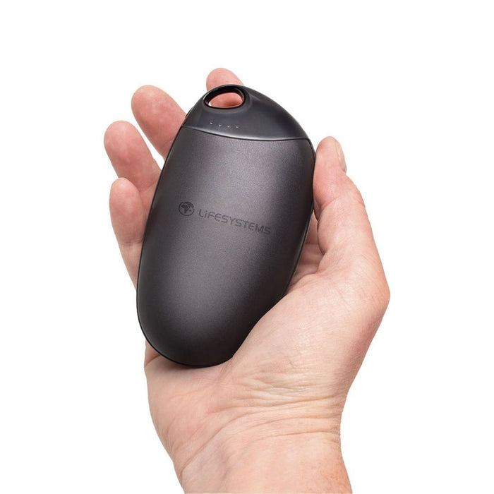 Lifesystems rechargeable hand warmer held in someones hand to show the size