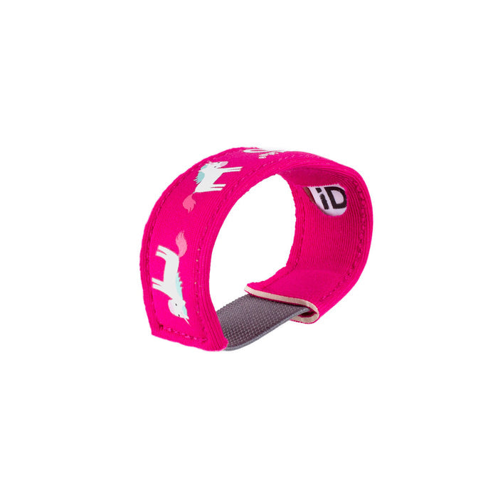 Studio shot on a white background of a Littlelife Identification wristband in the unicorn pattern on its side showing the slot for the ID information card