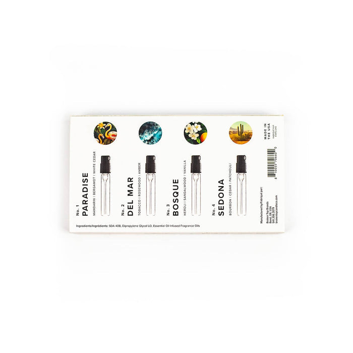 Four sample perfume vials arranged in a white Discovery Set box with circular icon artwork above.