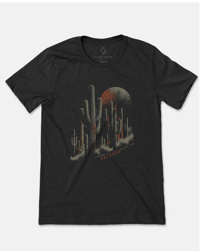 Front view of a dark charcoal T-shirt with the cactus desert graphic crossing the chest.