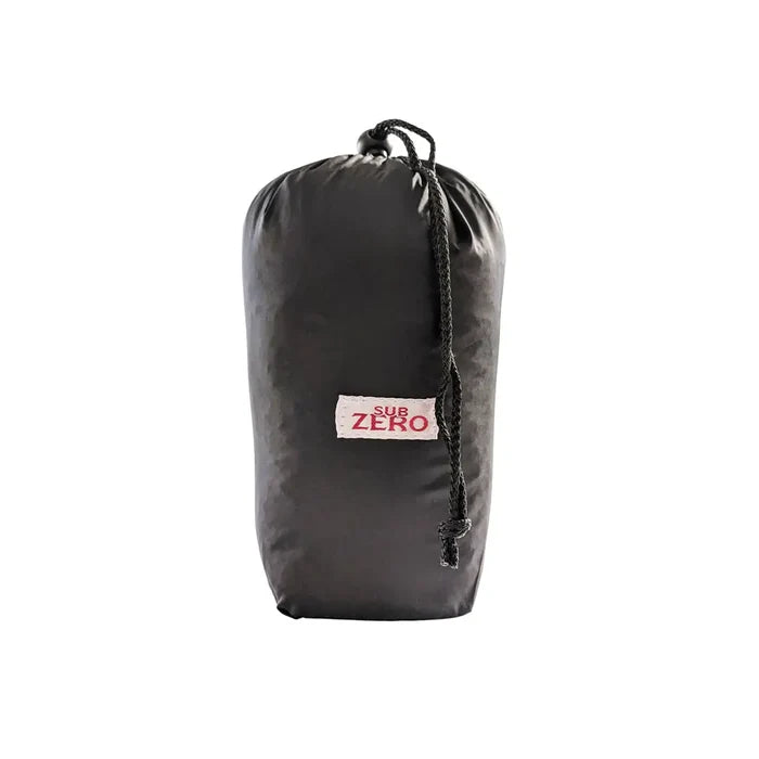 Sub Zero Meraklon fleece sleeping bag liner packed inits stuff sack on a white background