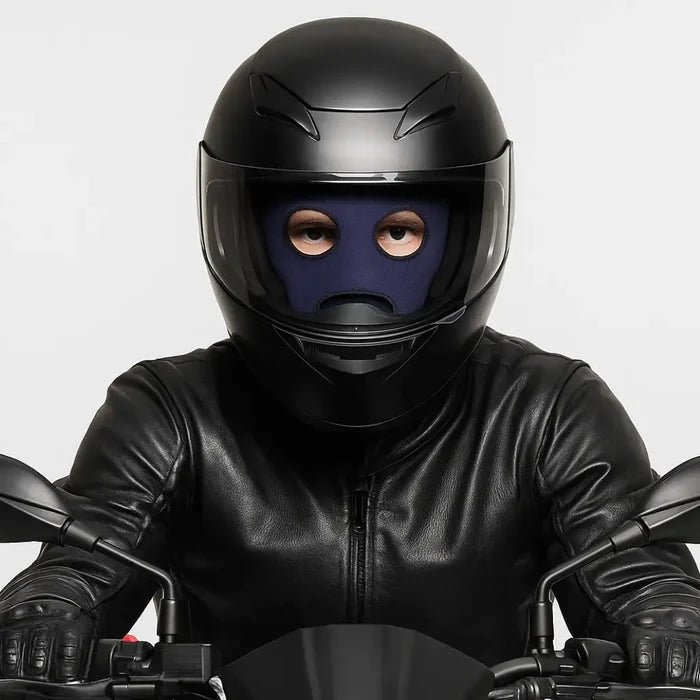 Person wearing a black helmet and a Sub Zero Meraklon three hole balaclava in navy  whilst sitting on a motorcycle against a white background