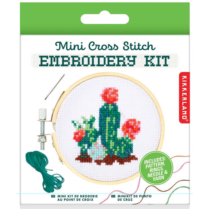 Packaging for Mini Cross Stitch Kit Cactus showing the cactus design inside a wooden embroidery hoop and bundled threads.