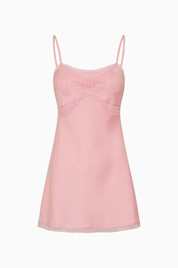 Pink camisole dress with thin straps on a white background