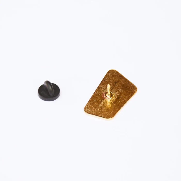 Back of Mountain Mama enamel pin with gold backing and black clutch