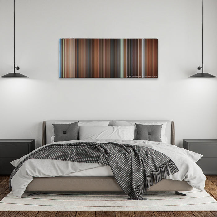 Mr. Deeds color palette canvas above a bed, between two black pendant lamps