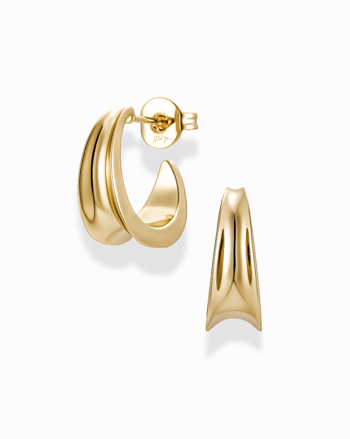 Gold inverted knife edge hoop earrings on a white background