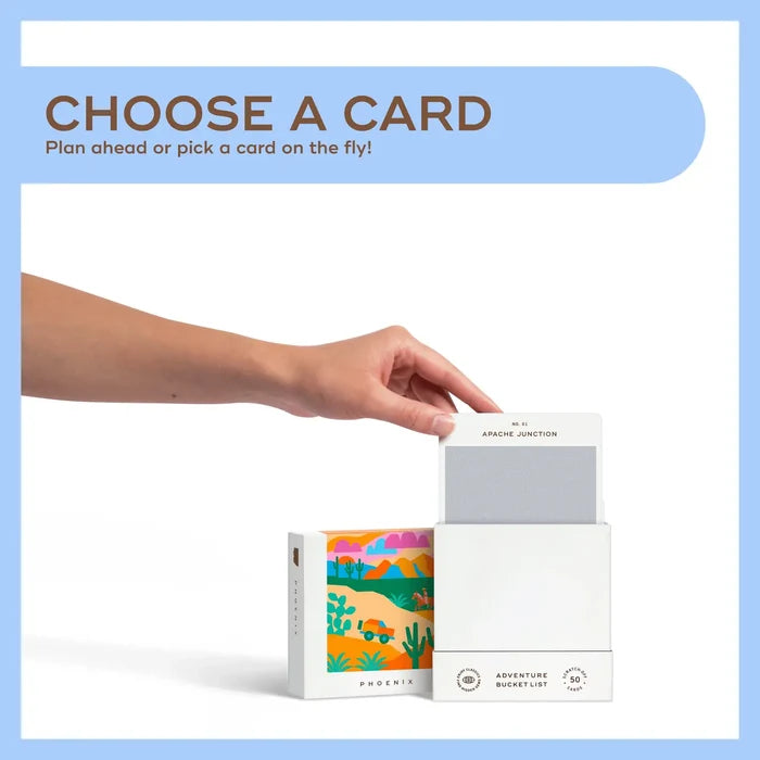 Hand reaching toward a card being pulled from a white Phoenix Adventure Bucket List display with a Choose a Card banner.