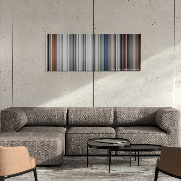Pleasantville color palette canvas on a concrete wall above a gray sectional sofa