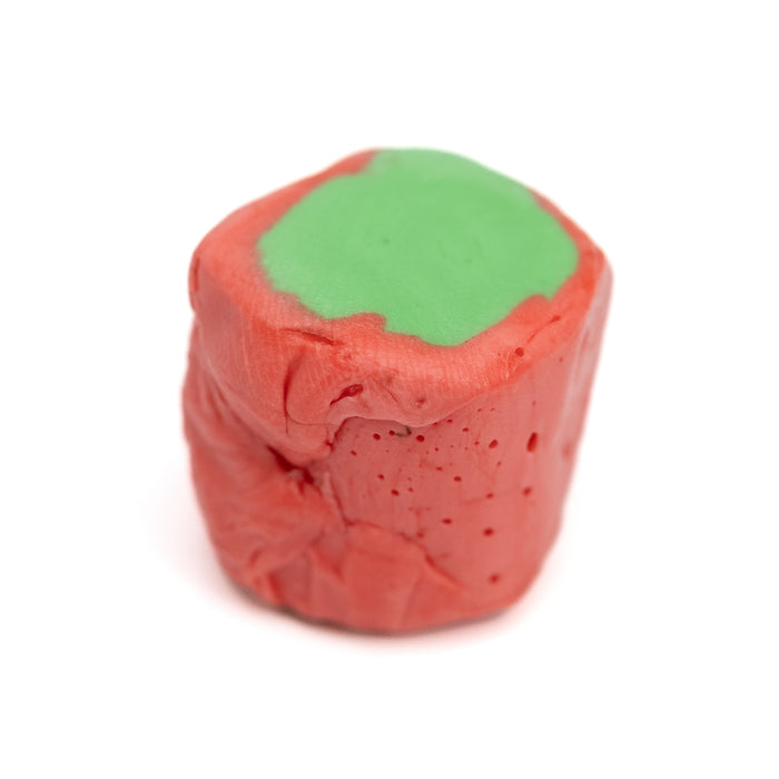 Prickly pear salt water taffy piece with red exterior and green top