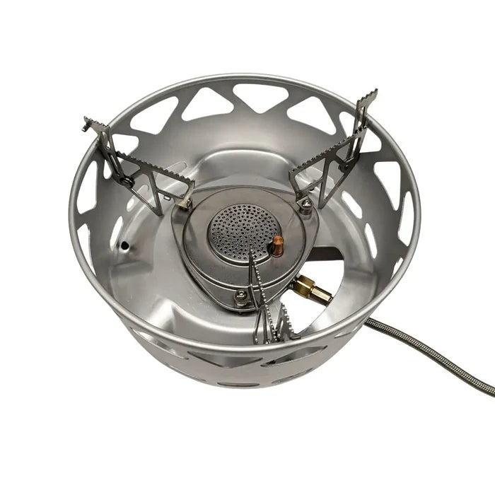 Birds eye view of the Primus Essential stove sets burner showing the integrated wind shield and gas hose