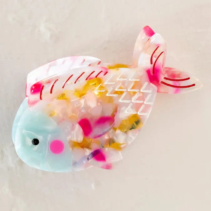 Translucent rainbow fish clip filled with multicolor confetti.