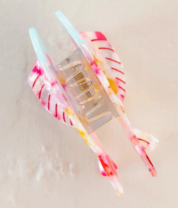 Pastel Rainbow Fish Icon Clip hair accessory with soft pink blue and yellow tones