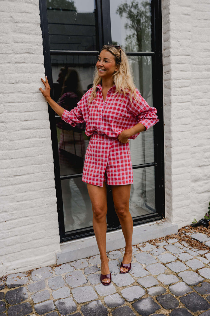 Red and Pink Plaid Dicki Shirt worn open over an outfit