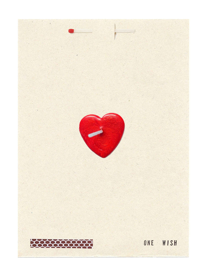 Card with a red heart-shaped candle on a beige background with 'ONE WISH' text. Candle wax and wick in the center of the card.
