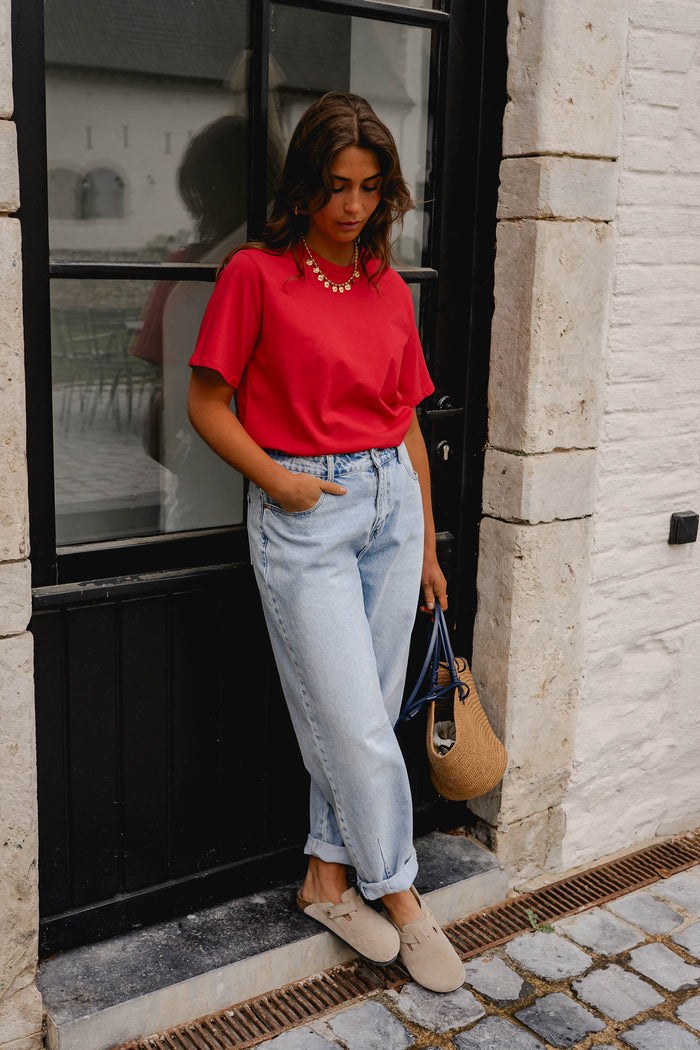 Red Jane crewneck t-shirt styled with light wash jeans, front view