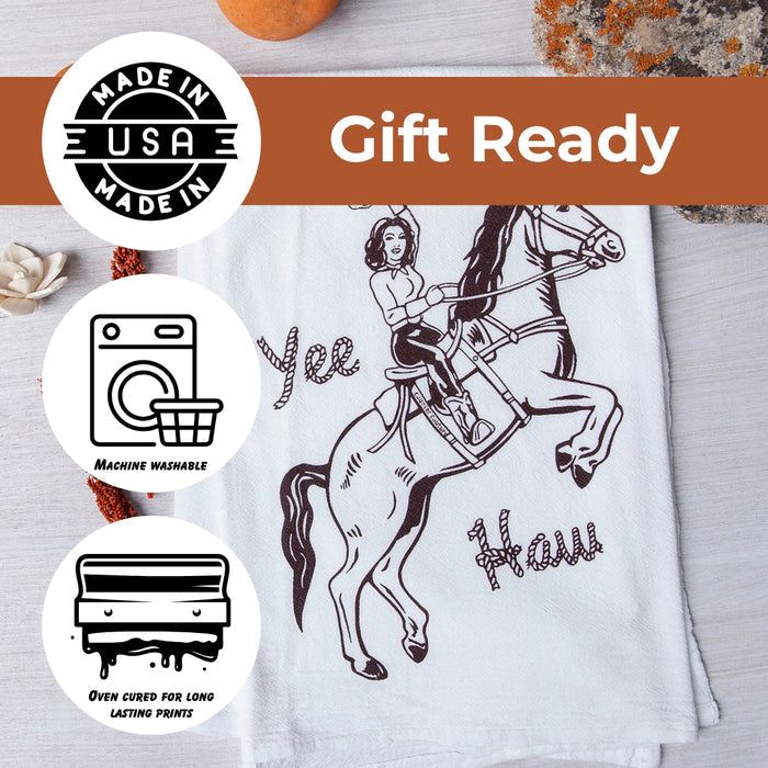 White tea towel with a vintage cowboy on a rearing horse illustration and a gift ready banner.