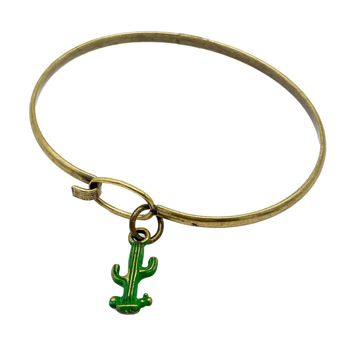 Gold tone bracelet with a dangling green cactus charm