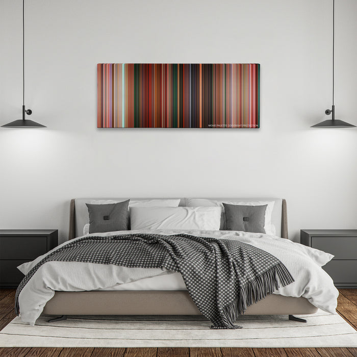 Sausage Party color palette canvas above a bed, between two black pendant lamps