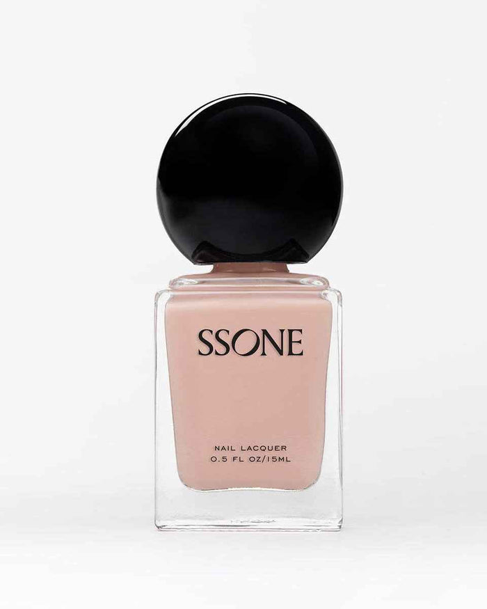 SSONE light pink nail polish bottle with black cap on a white background