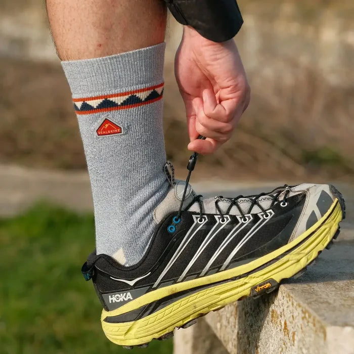 Sealskinz Kimberley bamboo hiking sock worn with a Hoka trainer outdoors
