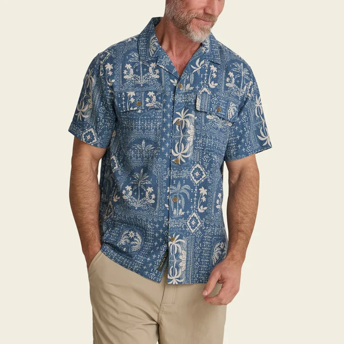 Man wearing Shores Club Shirt in Palmetto Prophesy Storm Blue with tropical print front view
